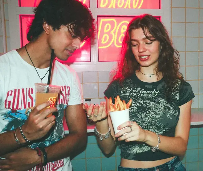 B60 Burgers couple fries neon Dubai